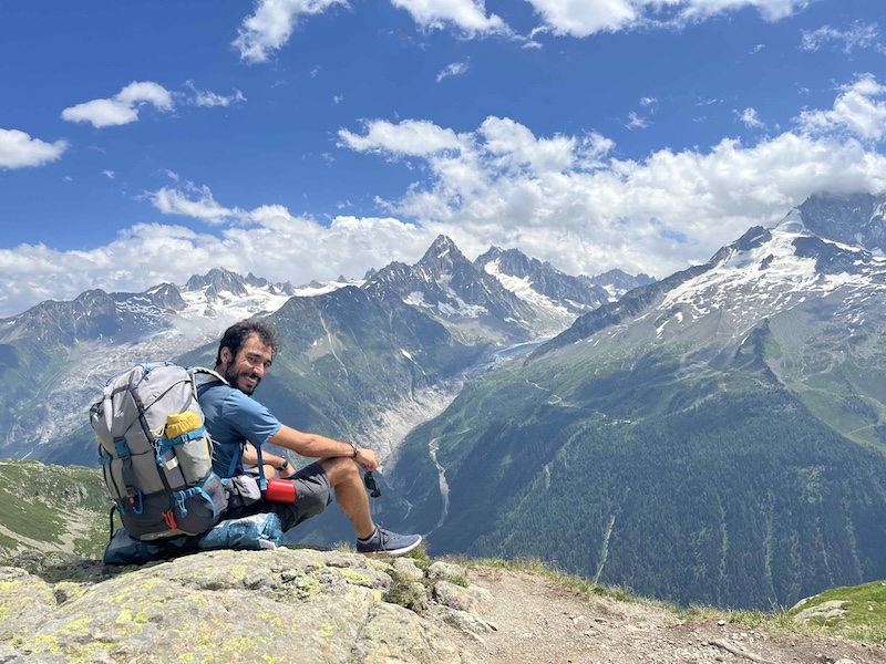 Mujtaba sitting on a mountain callde Mount Blanc